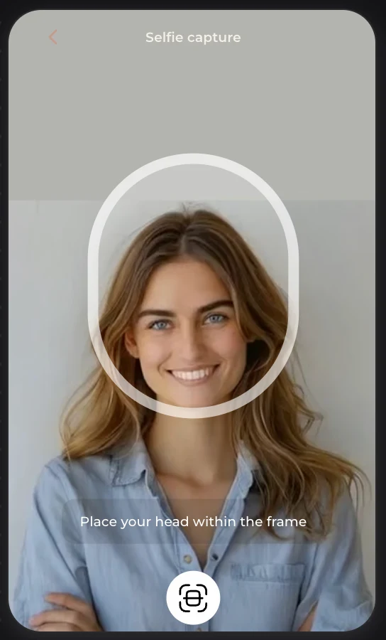 Selfie capture screen with an oval frame and the prompt to place your head within the frame.